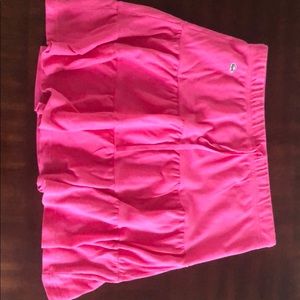 Hot pink Lacoste tiered skater skirt.